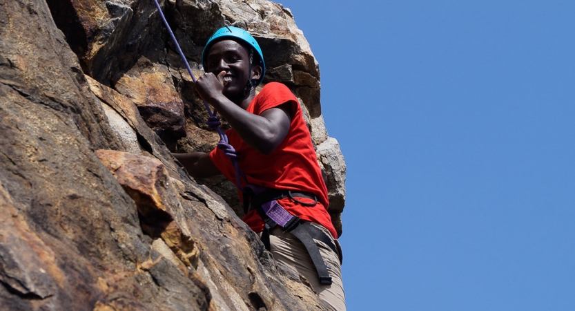 teens learn rock climbing skills in maine